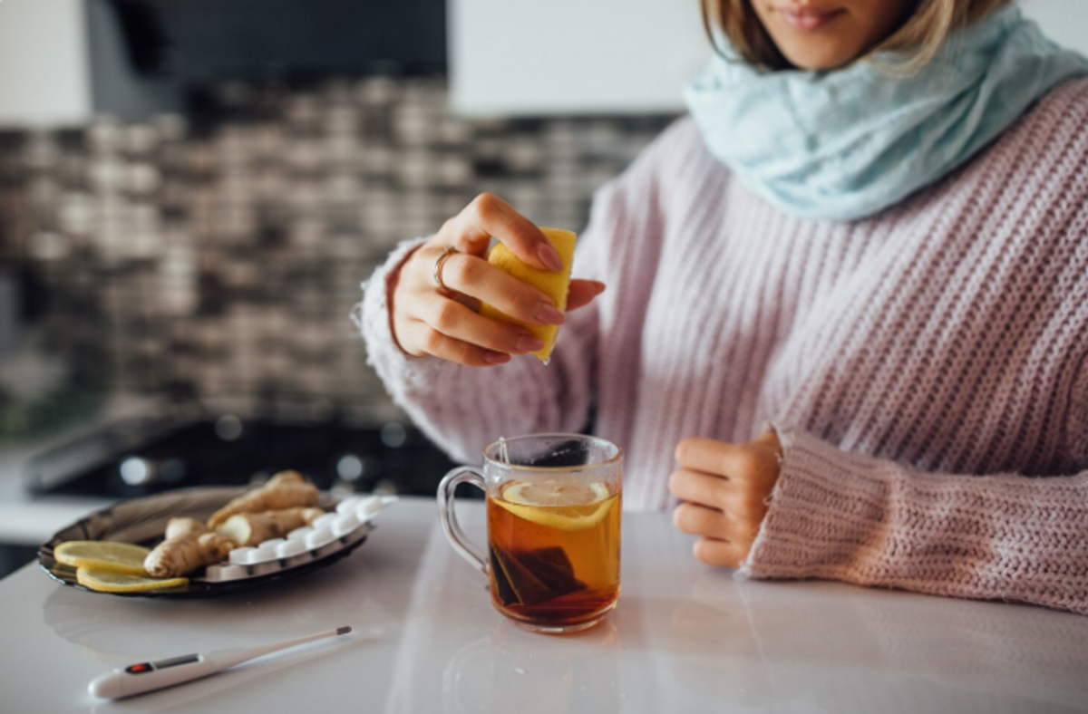 female hands squeezing lemon